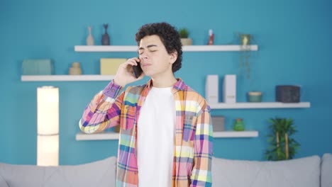 A-teenage-boy-gets-frustrated-when-he-gets-bad-news-on-the-phone.
